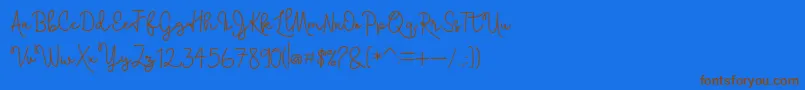 Skolateka-Schriftart – Braune Schriften auf blauem Hintergrund