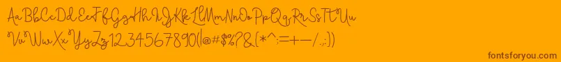 Skolateka-Schriftart – Braune Schriften auf orangefarbenem Hintergrund
