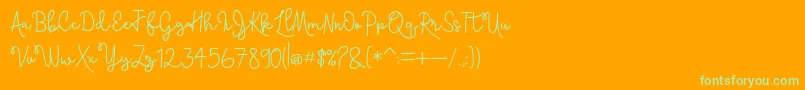 Skolateka-Schriftart – Grüne Schriften auf orangefarbenem Hintergrund