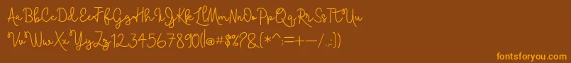 Skolateka-Schriftart – Orangefarbene Schriften auf braunem Hintergrund