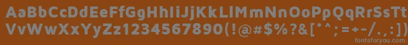 MavenProBlack-fontti – harmaat kirjasimet ruskealla taustalla