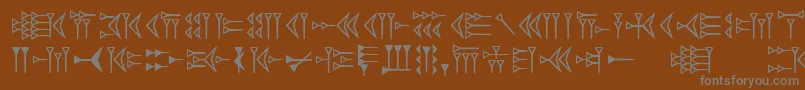 Easycuneiform-Schriftart – Graue Schriften auf braunem Hintergrund