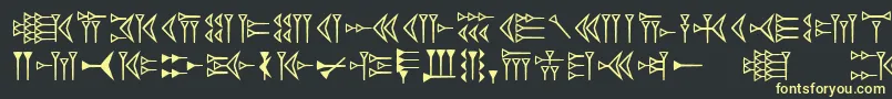 フォントEasycuneiform – 黒い背景に黄色の文字