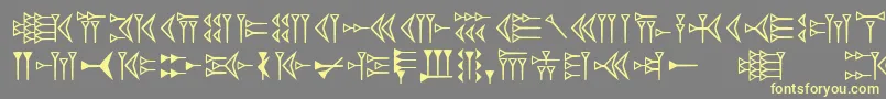 Easycuneiform Font – Yellow Fonts on Gray Background