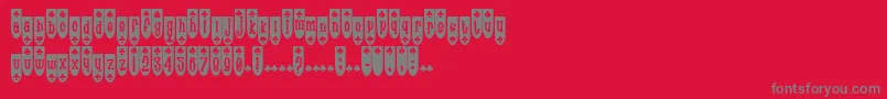 PopuluxeBlub-fontti – harmaat kirjasimet punaisella taustalla