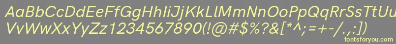 HkgroteskMediumlegacyitalic Font – Yellow Fonts on Gray Background