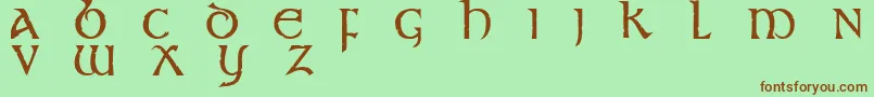 フォントStonecross – 緑の背景に茶色のフォント
