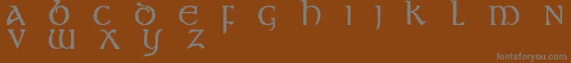 Stonecross-fontti – harmaat kirjasimet ruskealla taustalla