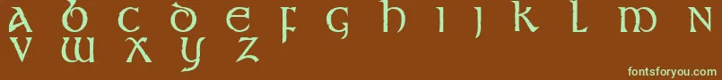 フォントStonecross – 緑色の文字が茶色の背景にあります。