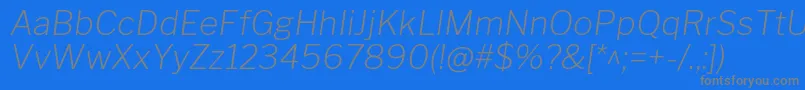 フォントLibrefranklinExtralightitalic – 青い背景に灰色の文字