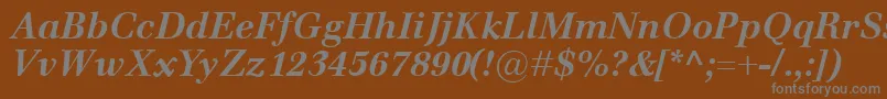 EmonaBolditalic-fontti – harmaat kirjasimet ruskealla taustalla