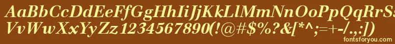 EmonaBolditalic-fontti – keltaiset fontit ruskealla taustalla