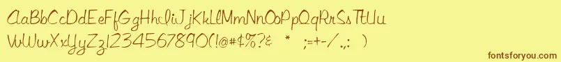 Fonte Libbyscript2 – fontes marrons em um fundo amarelo