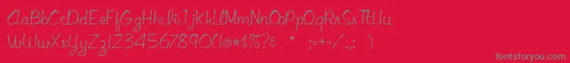 Fonte Libbyscript2 – fontes cinzas em um fundo vermelho