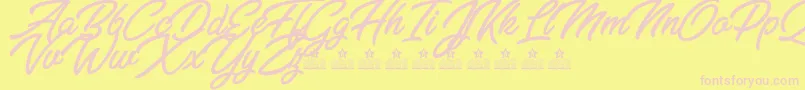 Шрифт ZabritzkyesPersonalUse – розовые шрифты на жёлтом фоне