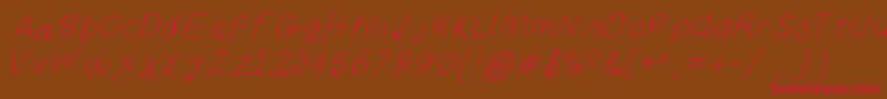 フォントCurlykueita – 赤い文字が茶色の背景にあります。