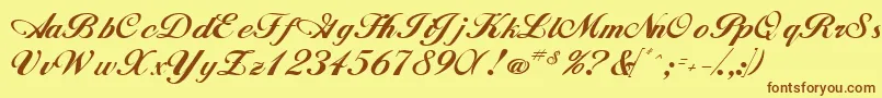 フォントWhimsiScriptSsk – 茶色の文字が黄色の背景にあります。