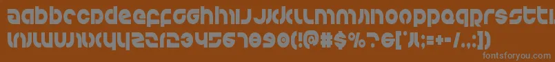 Kovacscond-fontti – harmaat kirjasimet ruskealla taustalla