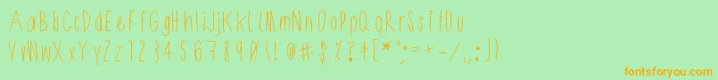 Shithead-Schriftart – Orangefarbene Schriften auf grünem Hintergrund