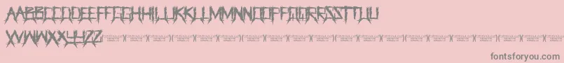 Fonte ThegrinderRegular – fontes cinzas em um fundo rosa
