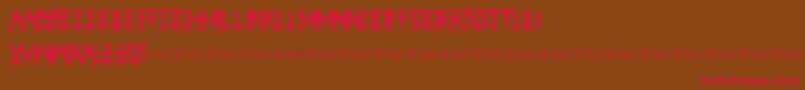 ThegrinderRegular Font – Red Fonts on Brown Background