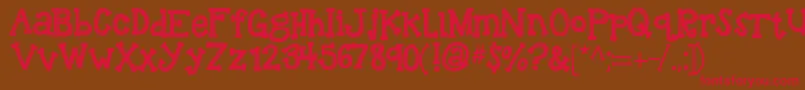 フォントKbreindeergames – 赤い文字が茶色の背景にあります。