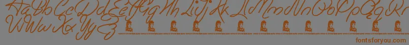 フォントEasyRider – 茶色の文字が灰色の背景にあります。