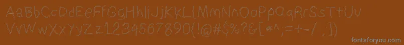 Suplexdriverregularol Font – Gray Fonts on Brown Background