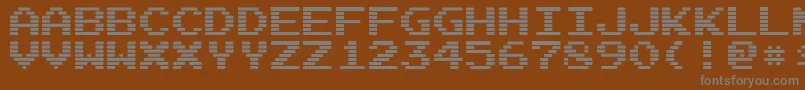 Шрифт ArcadeInterlaced – серые шрифты на коричневом фоне