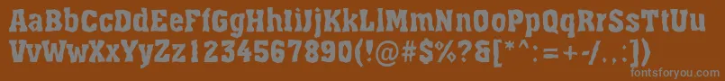 More about AAssuanbrk Font AAssuanbrk Font – Gray Fonts on Brown Background