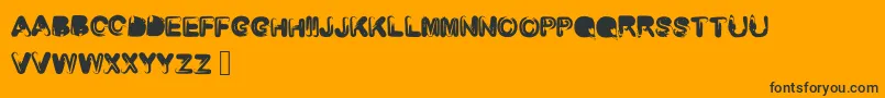 Czcionka Roundedbrush – czarne czcionki na pomarańczowym tle