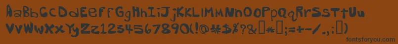 フォントDorkbutt – 黒い文字が茶色の背景にあります