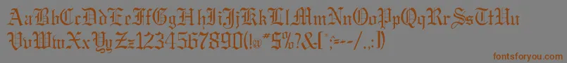 フォントGregordbNormal – 茶色の文字が灰色の背景にあります。