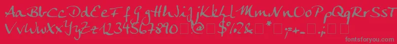 Fonte Ankecalligraph – fontes cinzas em um fundo vermelho