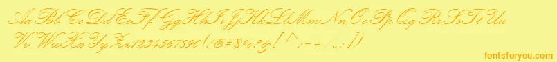 フォントKunstlerScript – オレンジの文字が黄色の背景にあります。