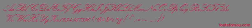 KunstlerScript-Schriftart – Rote Schriften auf grauem Hintergrund