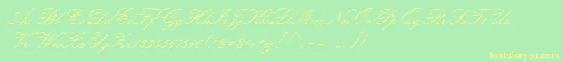 KunstlerScript Font – Yellow Fonts on Green Background