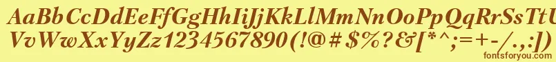 フォントPetersburgBolditalicCyrillic – 茶色の文字が黄色の背景にあります。