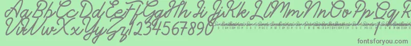 フォントSunderlinesDemo – 緑の背景に灰色の文字