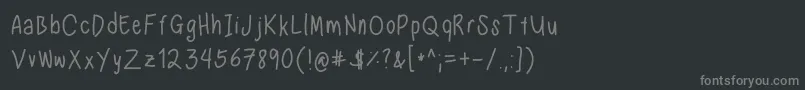 Fonte NadeznasHandwritingRegular – fontes cinzas em um fundo preto
