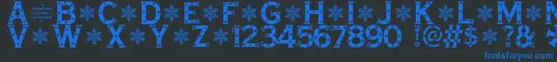Fonte SnowflakeLetters – fontes azuis em um fundo preto