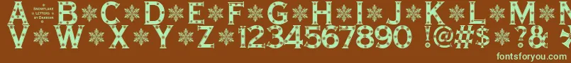 SnowflakeLetters-fontti – vihreät fontit ruskealla taustalla