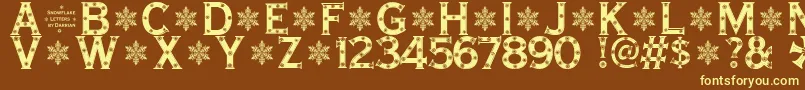 SnowflakeLetters Font – Yellow Fonts on Brown Background