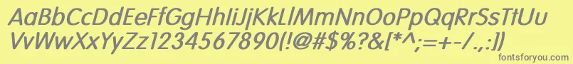 VogueNormalBoldItalic-fontti – harmaat kirjasimet keltaisella taustalla