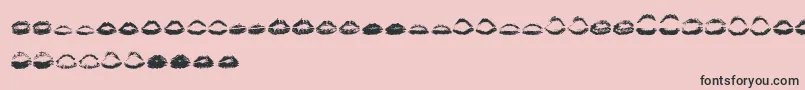 フォントKissKissOtf – ピンクの背景に黒い文字