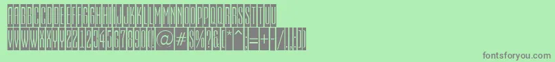 EmpirialcmRegular-fontti – harmaat kirjasimet vihreällä taustalla