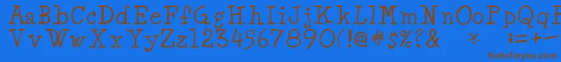 フォントMinyaRegular – 茶色の文字が青い背景にあります。