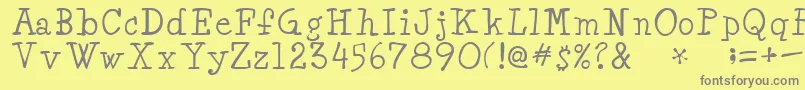 フォントMinyaRegular – 黄色の背景に灰色の文字