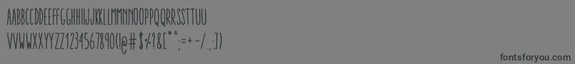 フォントAracneUltraCondensedRegular – 黒い文字の灰色の背景
