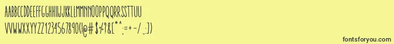 Fonte AracneUltraCondensedRegular – fontes pretas em um fundo amarelo